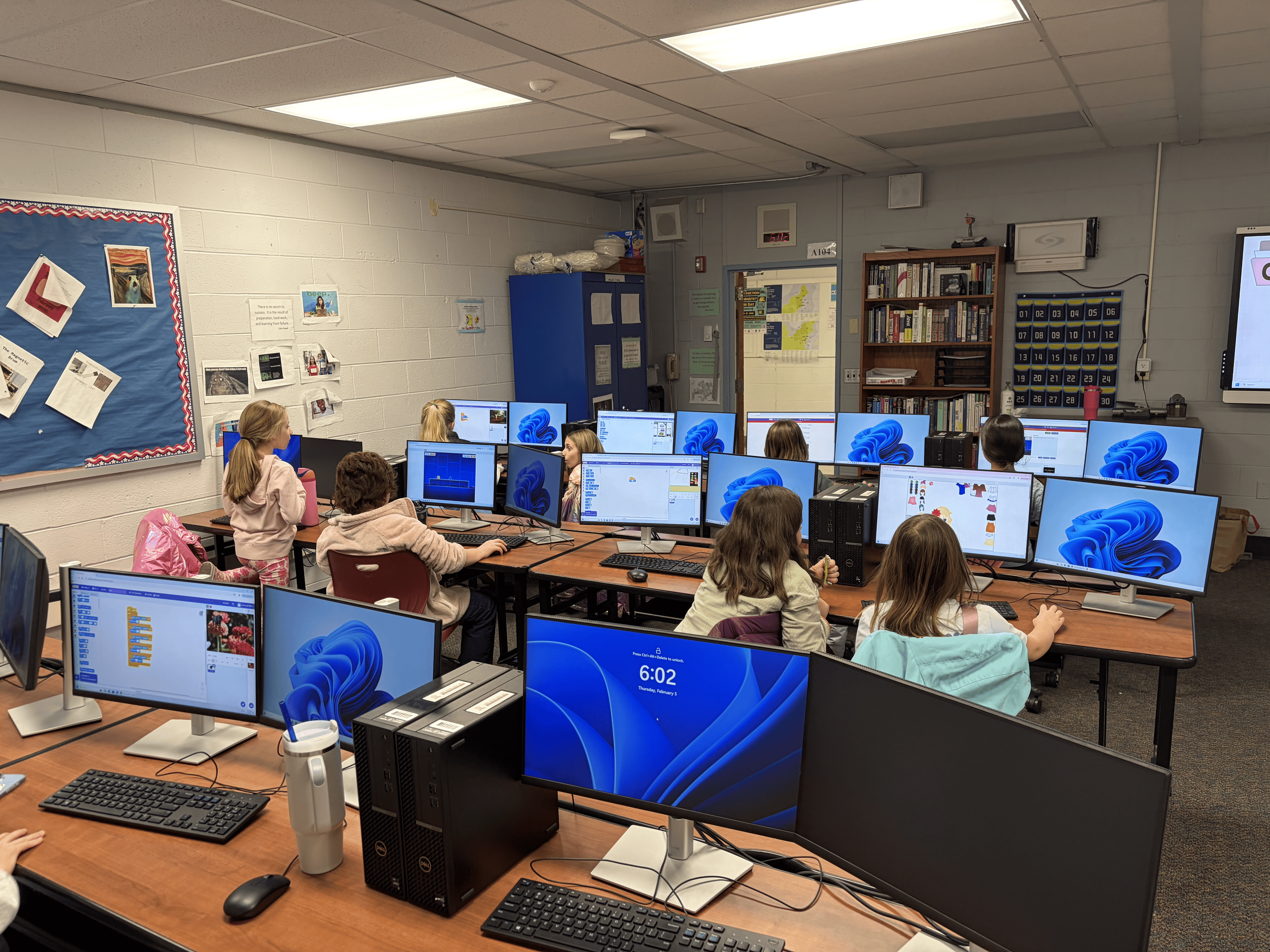 Students coding at the computer lab during a session