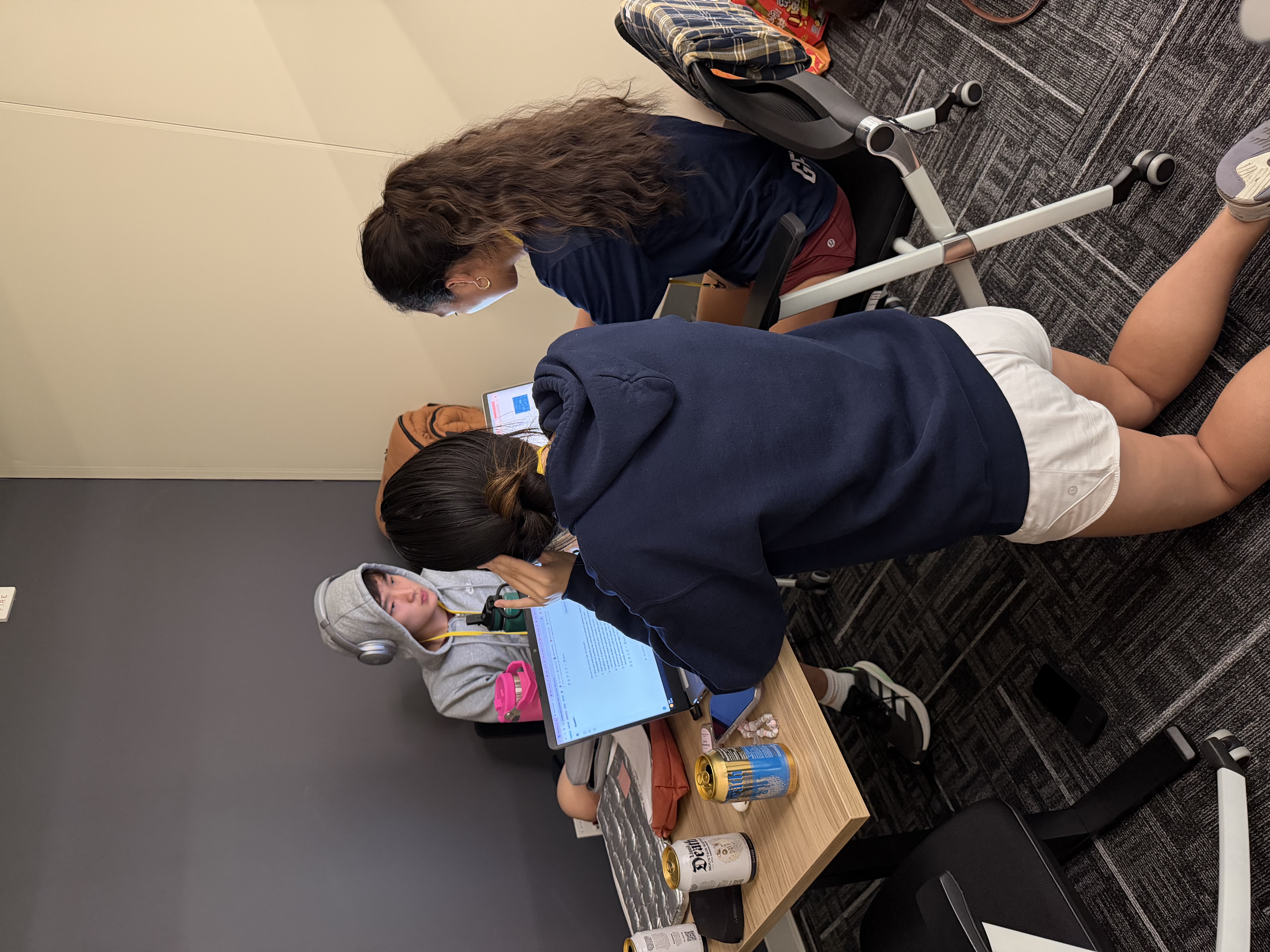 Students collaborating on laptops